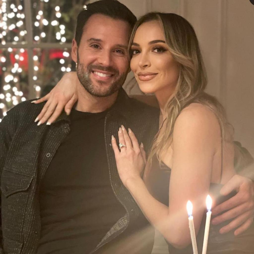 Farrah Aldjufrie and Alex Manos smiling and embracing.
