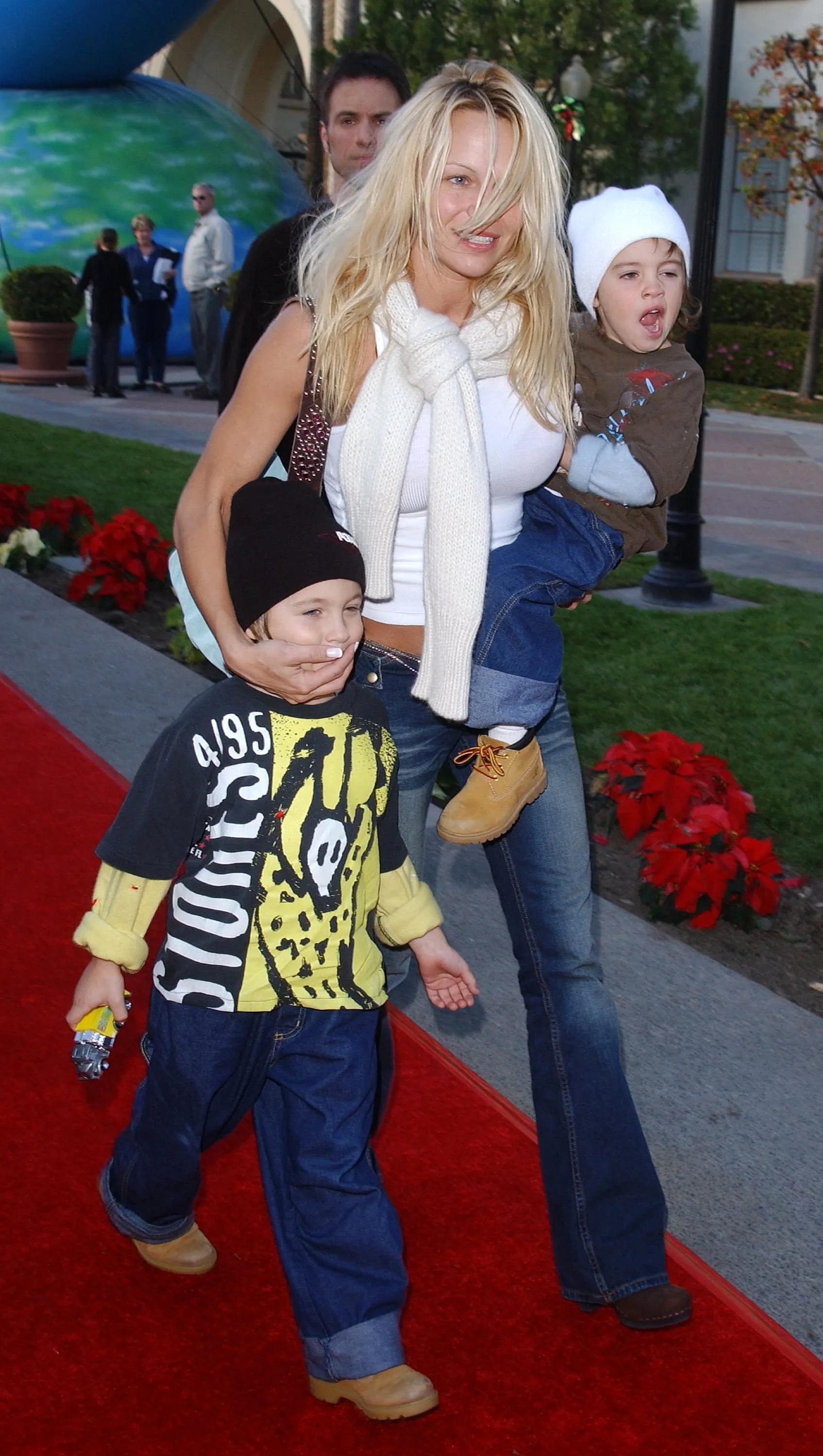 Pamela Anderson and her sons Dylan and Brandon on the red carpet at the