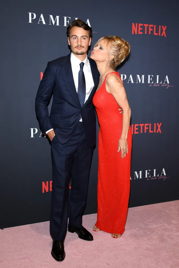 Pamela Anderson kisses Brandon Thomas Lee on the cheek at the premiere of