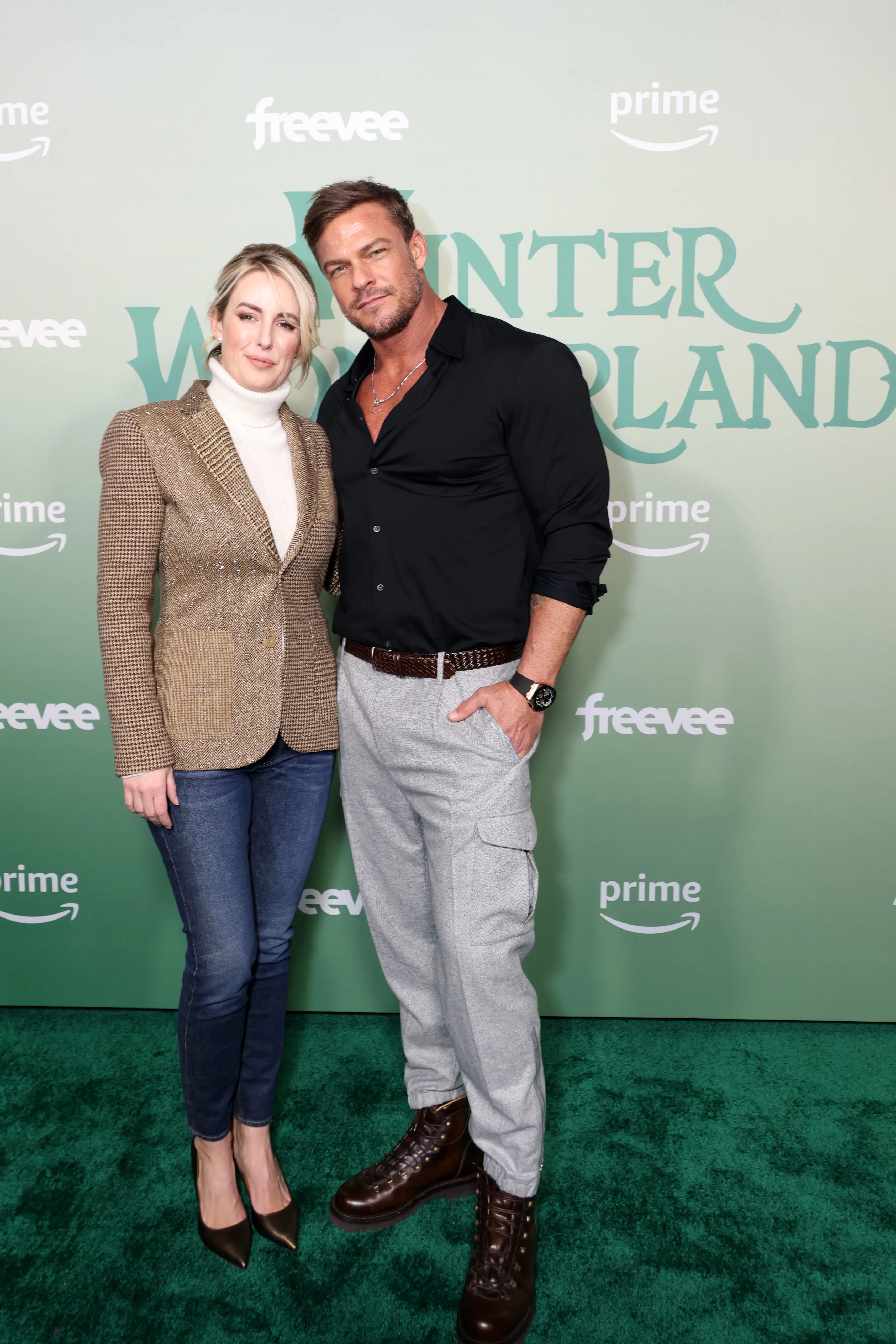 Catherine and Alan Ritchson pose together at the Winter Wonderland event.