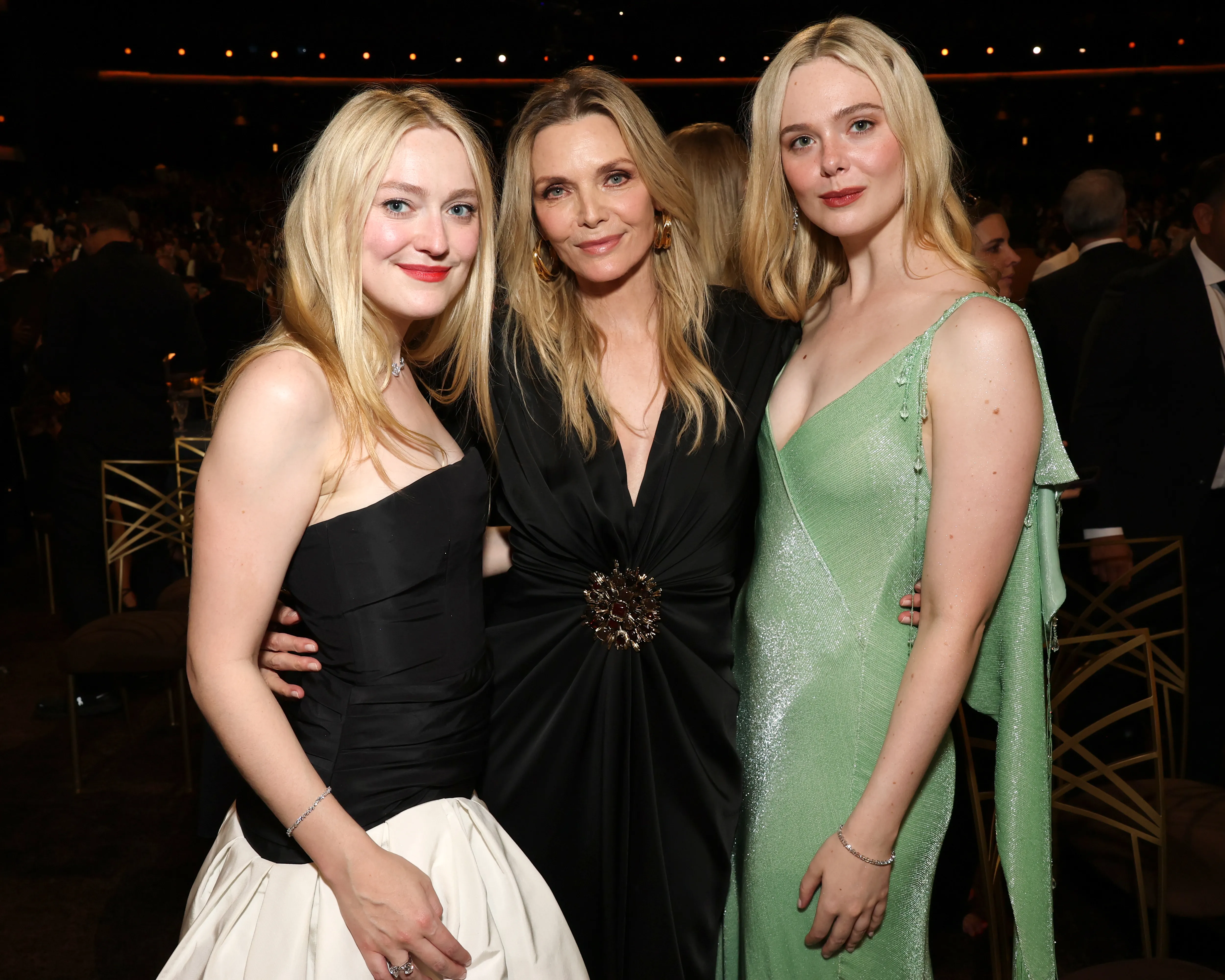 Dakota Fanning, Michelle Pfeiffer, and Elle Fanning posing together.