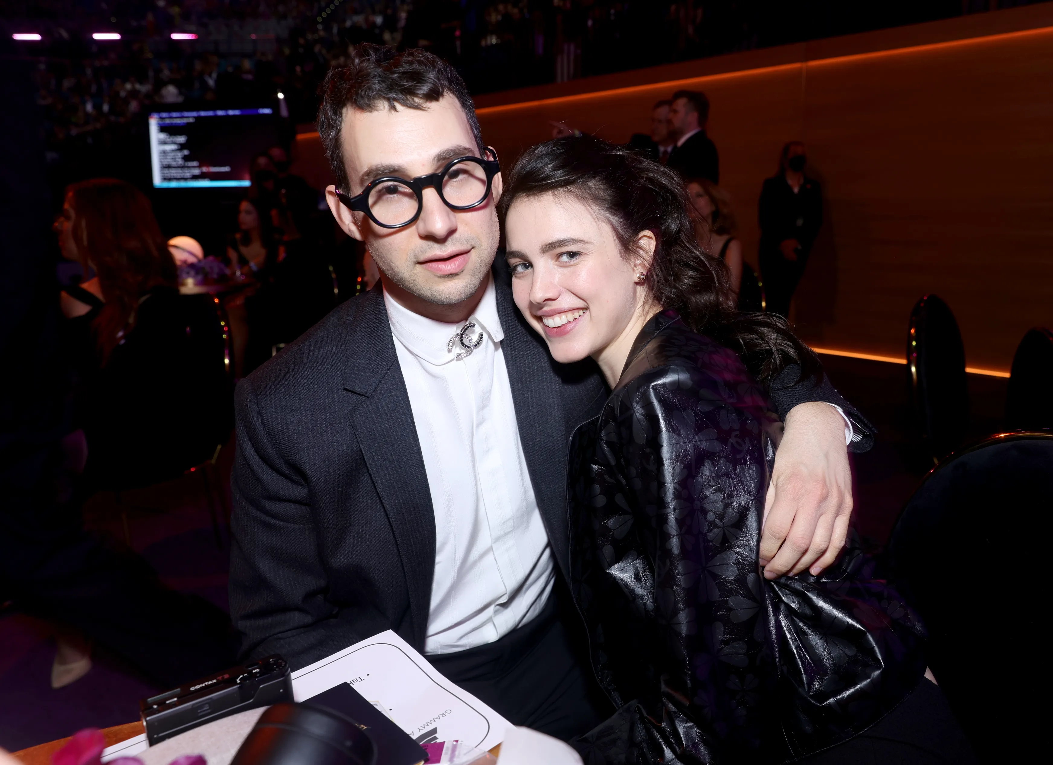 Jack Antonoff and Margaret Qualley smiling at the 64th Annual GRAMMY Awards.