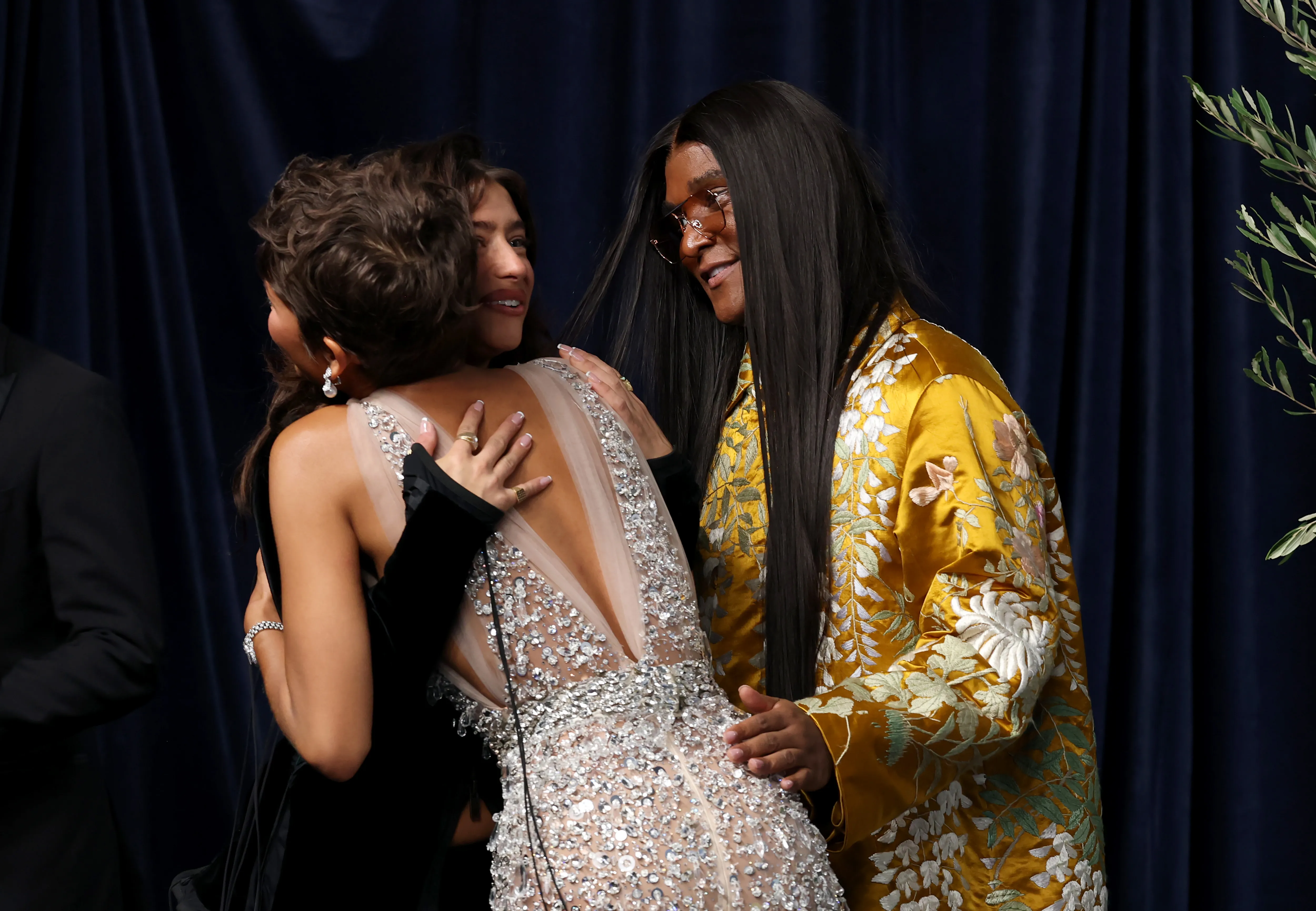 Zendaya hugging Odessa A'zion with Law Roach standing beside them at the 78th Primetime Emmy Awards.