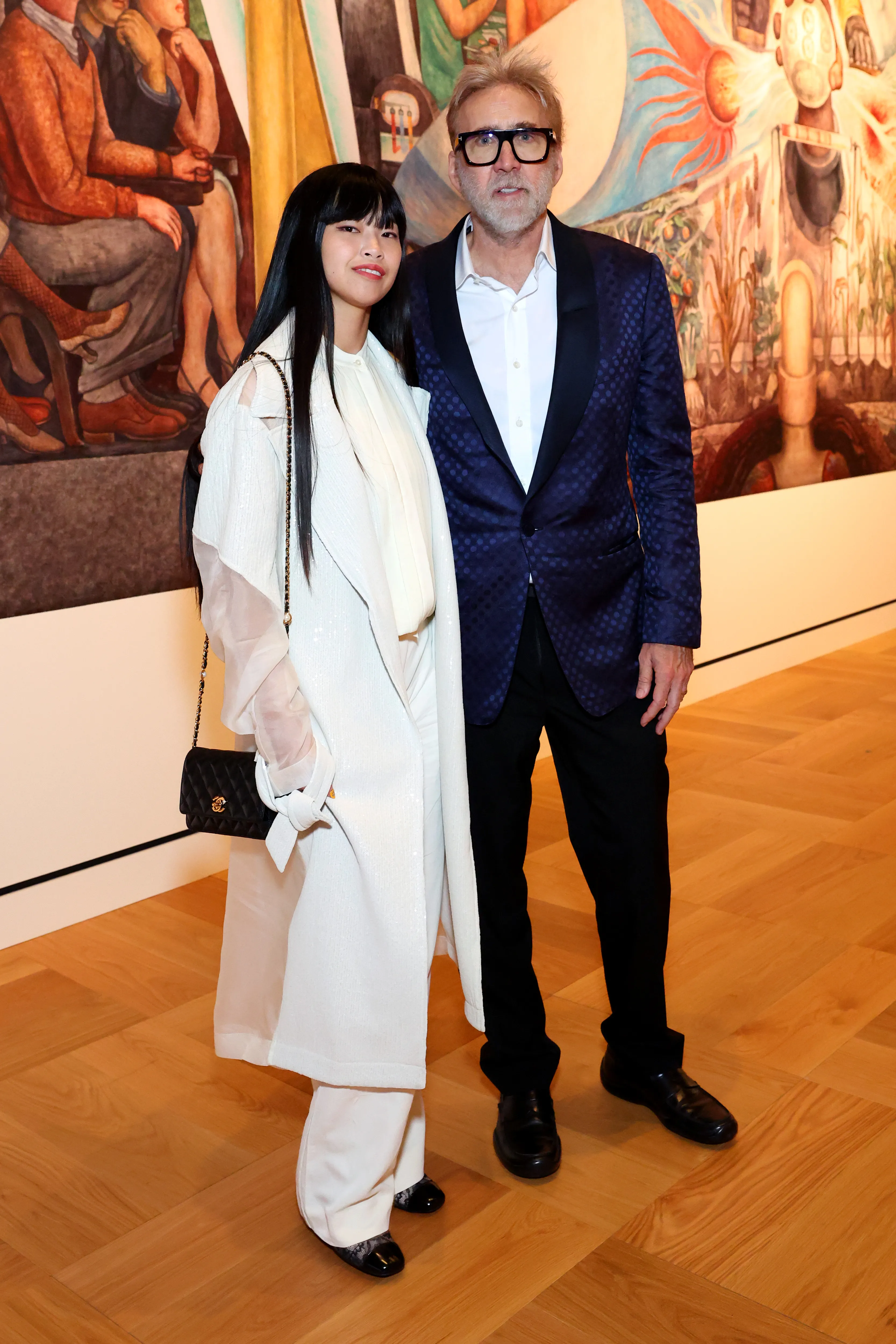 Riko Shibata and Nicolas Cage standing together at the Lucas Museum of Narrative Art.