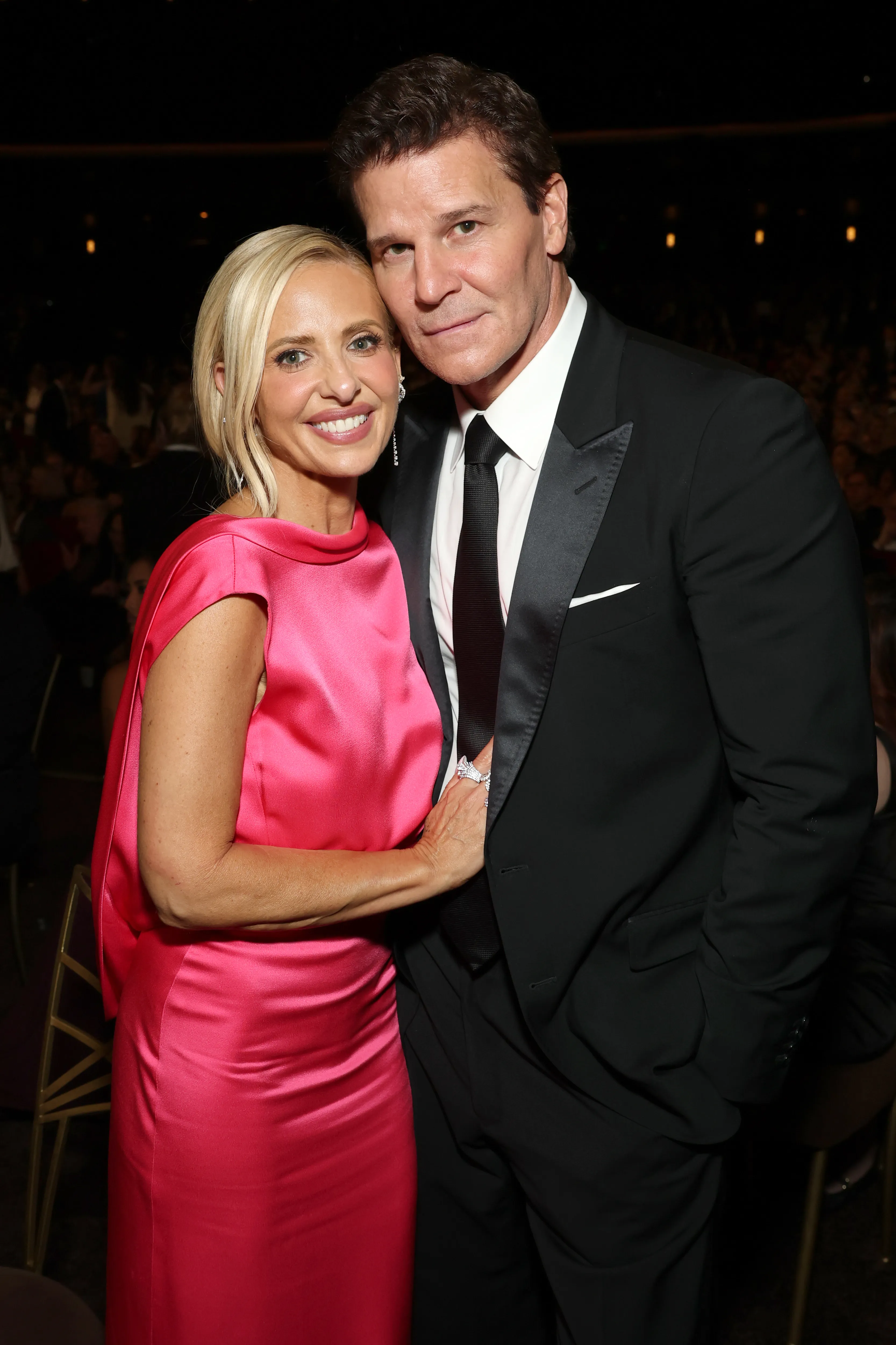 Sarah Michelle Gellar in a pink dress and David Boreanaz in a black tuxedo pose at the 78th Primetime Emmy Awards.