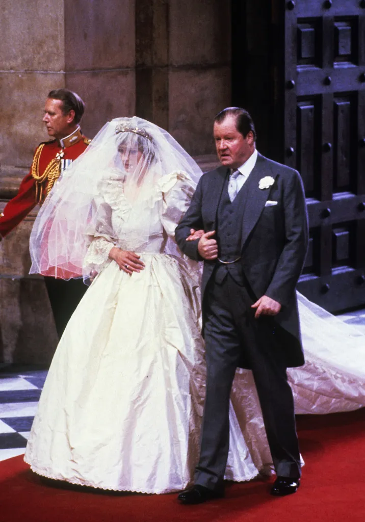 Lady Diana Spencer entering St. Paul's Cathedral in her wedding dress, escorted by her father, Earl Spencer.