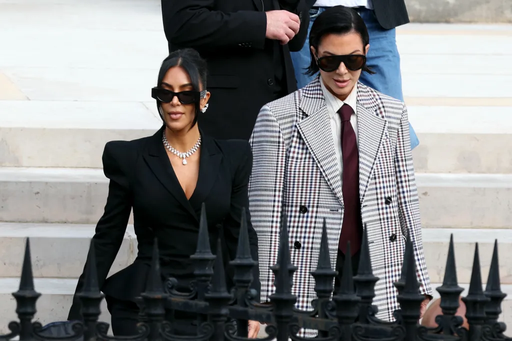 Kim Kardashian and Kris Jenner leave a courthouse.