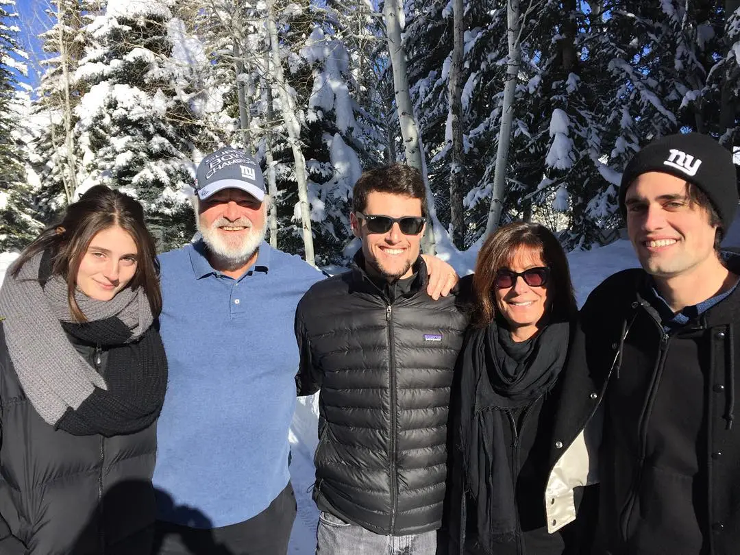 Romy, Rob, Jake, Michelle, and Nick Reiner posing for a photo in a snowy forest.