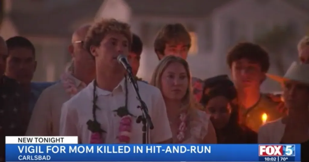 People gather at a vigil in Carlsbad to pay tribute to Vanessa Wheyland.