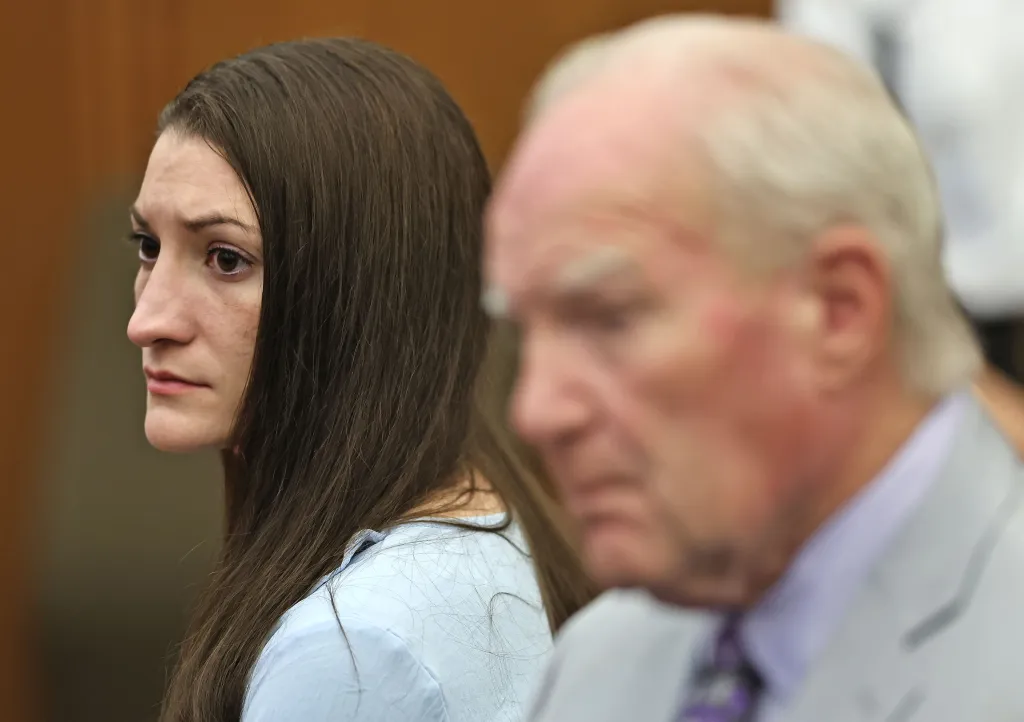Lindsay Clancy and her attorney Kevin Reddington watch as Judge William Sullivan tells the jury to keep discussing a possible verdict.