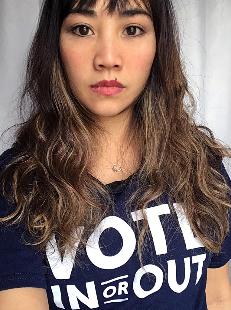 Lisa Chin Mollica, founder of Vote In Or Out, wearing a Vote In Or Out t-shirt.