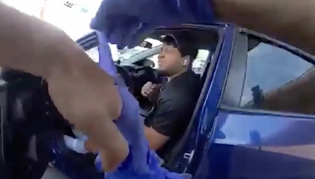 Officers wearing body cameras assisted Garces Perez out of the vehicle, contradicting claims that he was pulled out by agents, before placing him under arrest.