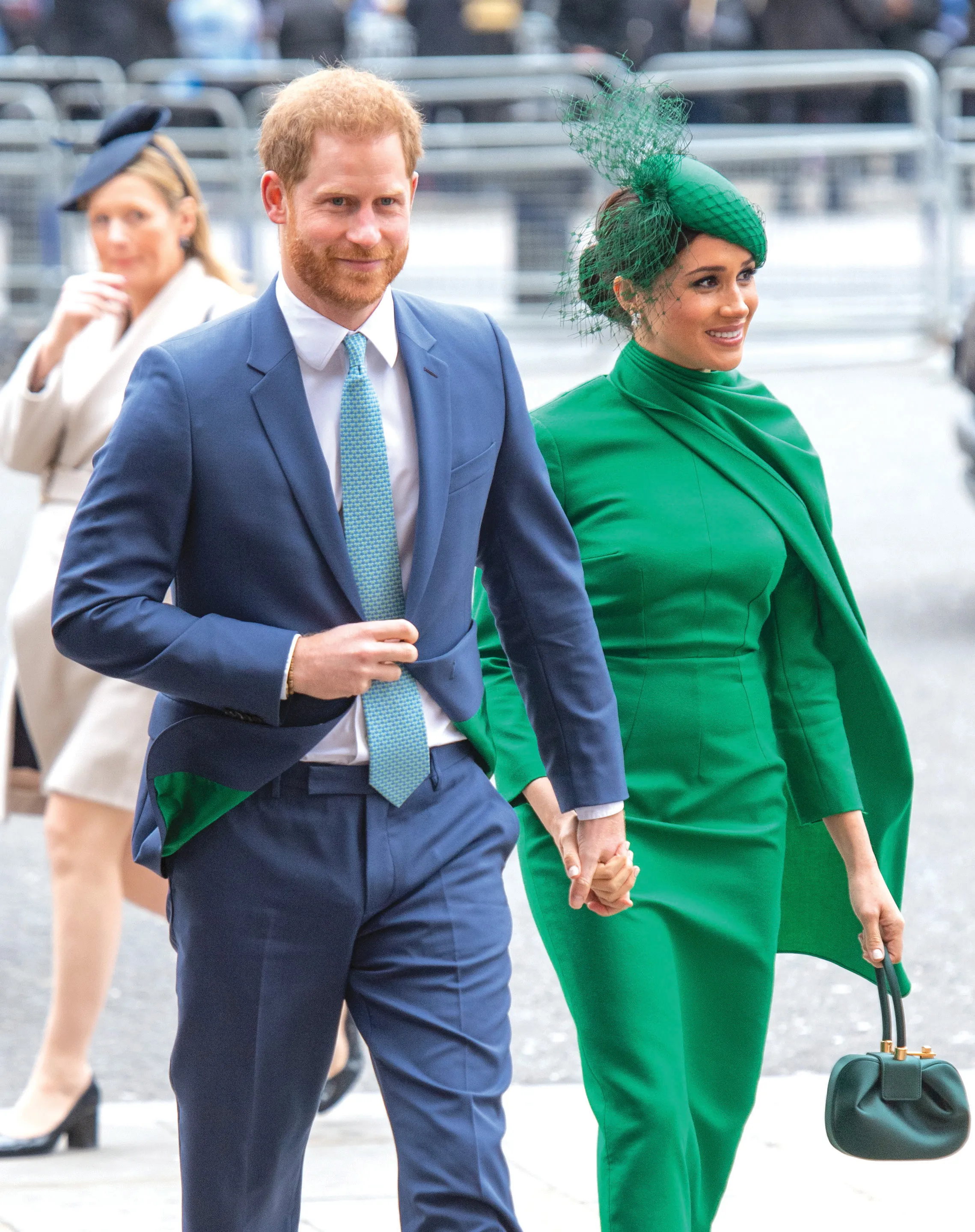 Meghan Markle, Duchess of Sussex, and Prince Harry, Duke of Sussex, walk hand-in-hand.