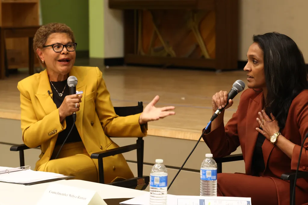 Los Angeles Mayor Karen Bass and city council member Nithya Raman speaking at a debate.