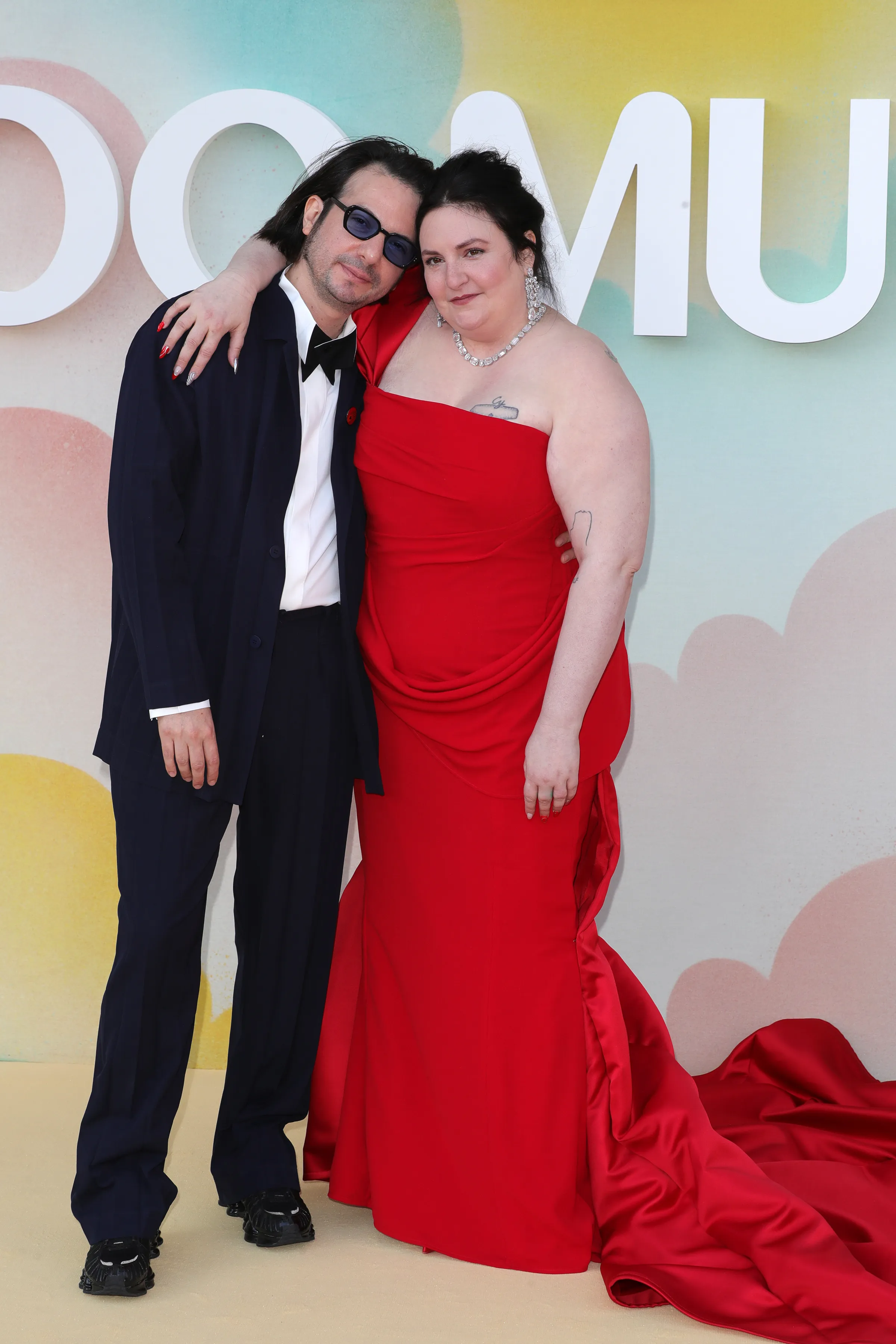 Luis Felber and Lena Dunham posing for a photo.