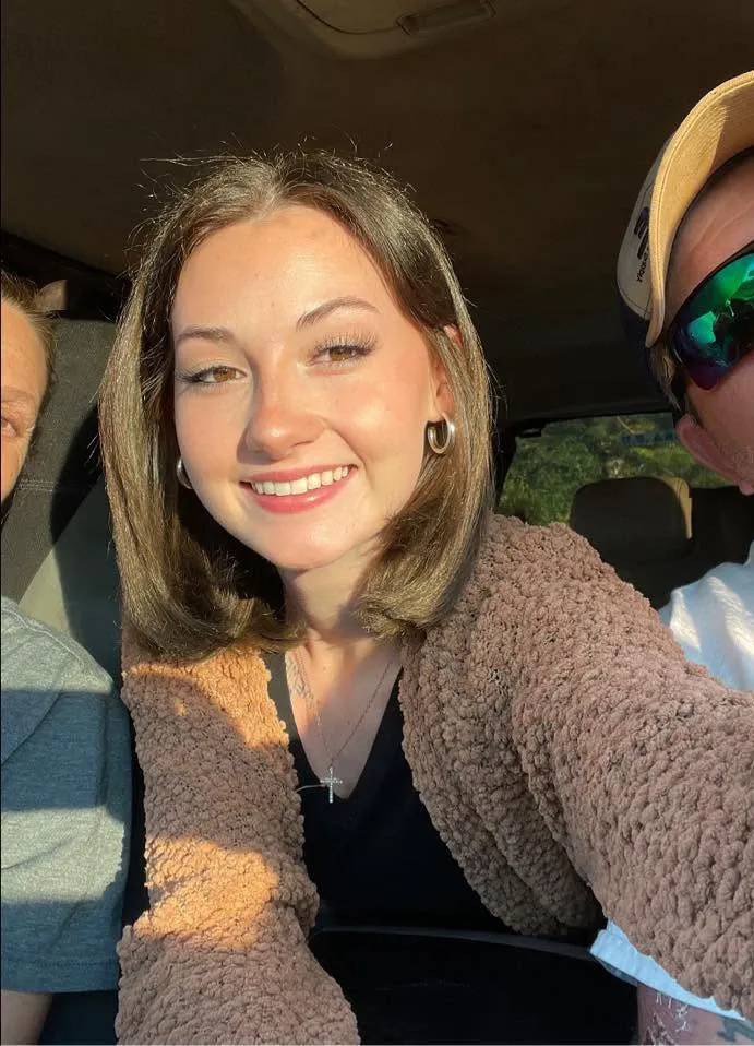 CloeRae McBrayer smiling in a car.