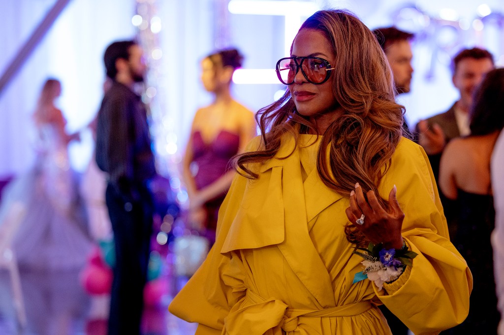 Mary Cosby from The Real Housewives of Salt Lake City in a yellow coat and sunglasses.