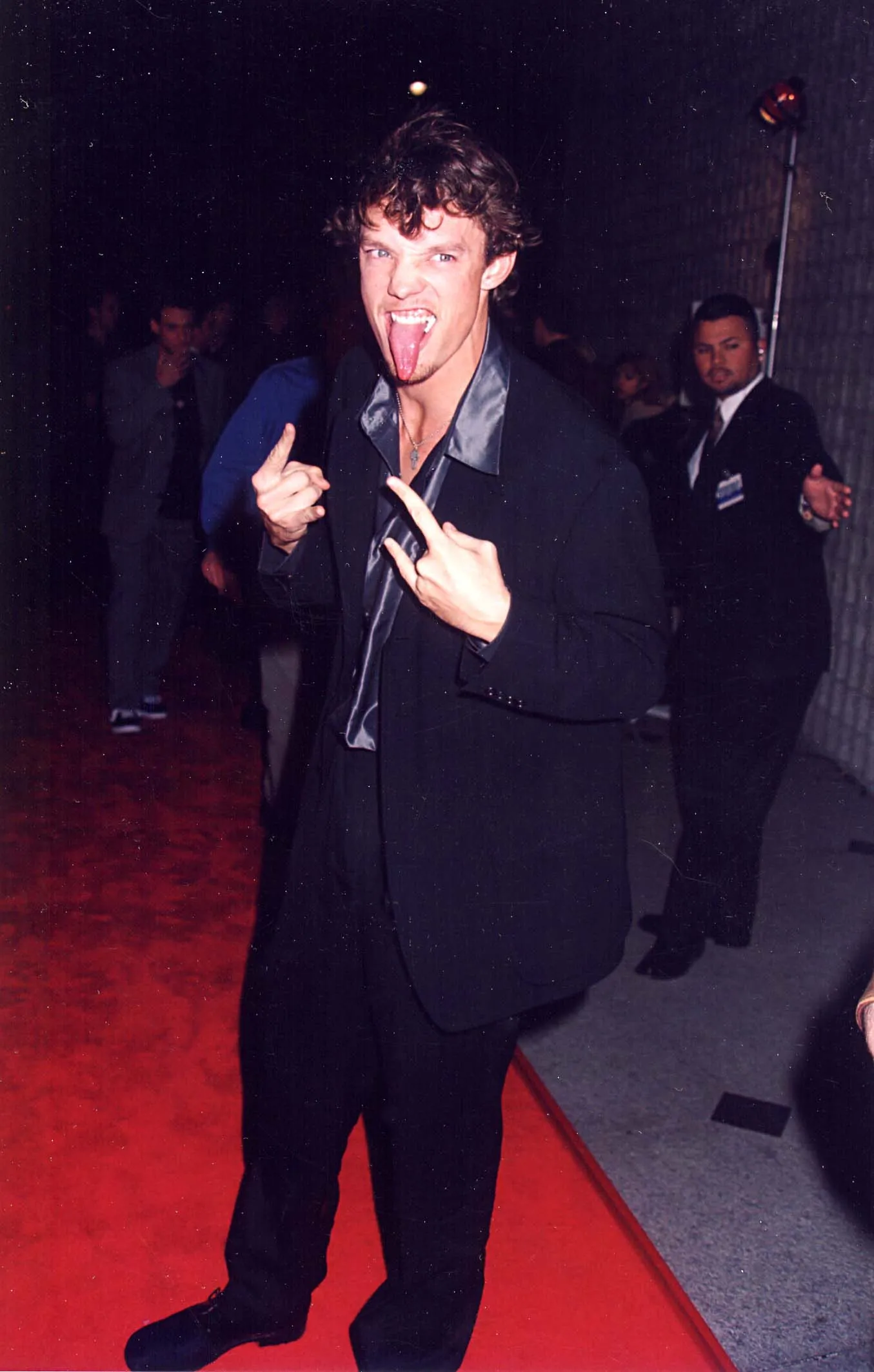 Matthew Lillard making a scary face and hand gestures on the red carpet at the 