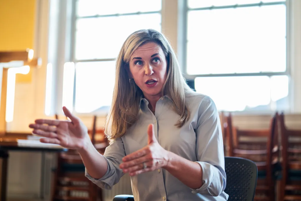 Maura Sullivan speaking with voters during a speed dating event at City Hall in Dover, New Hampshire.