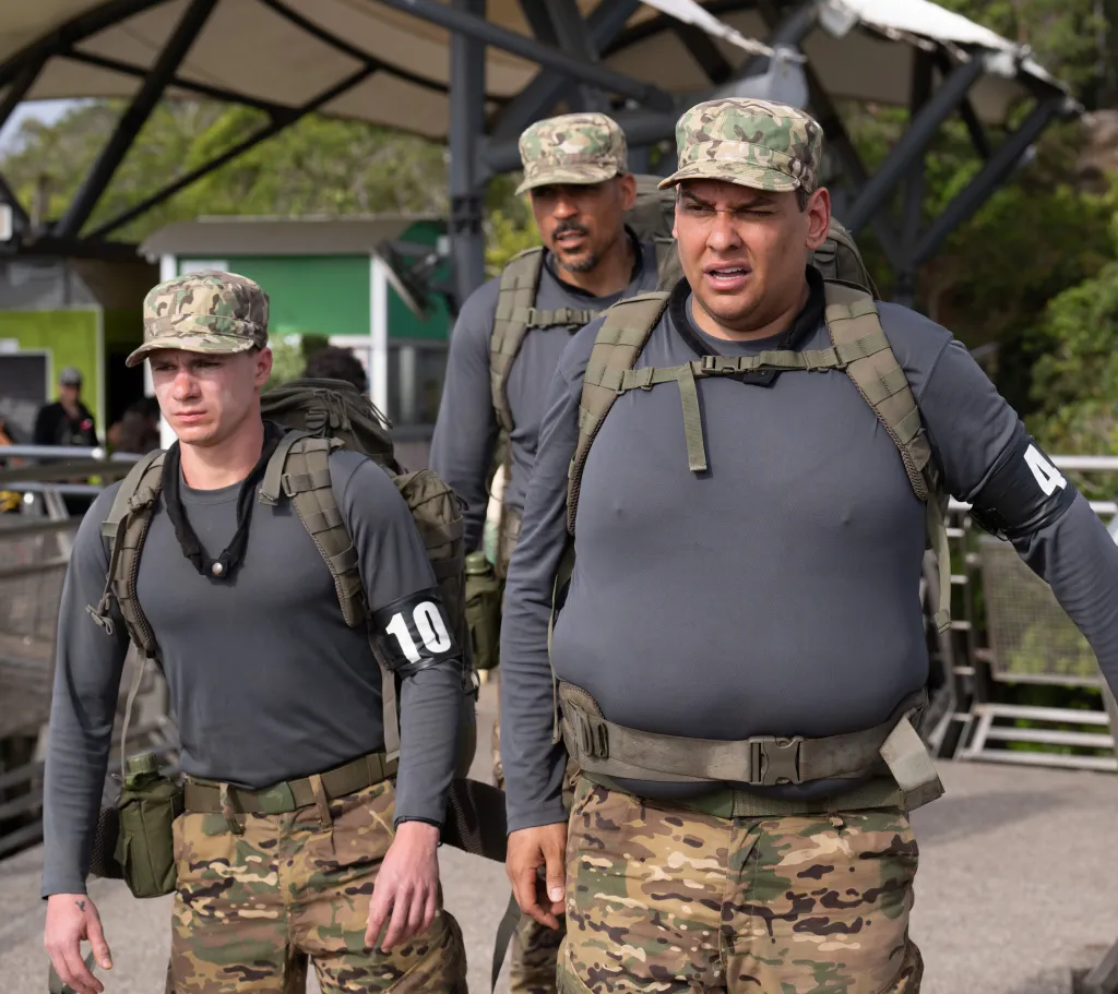 Maxim Naumov, Matt Barnes, and George Santos in uniform, carrying packs.