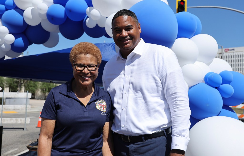 Mayor Karen Bass and John McKinney pose for a portrait.