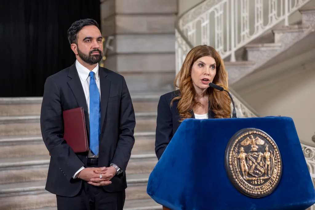 Mayor Zohran Mamdani and Julie Menin speaking to the press at City Hall about the NYC budget gap.