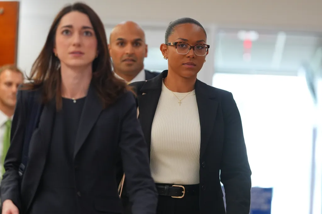 McKenna West walks in a hallway at family court in Dallas.