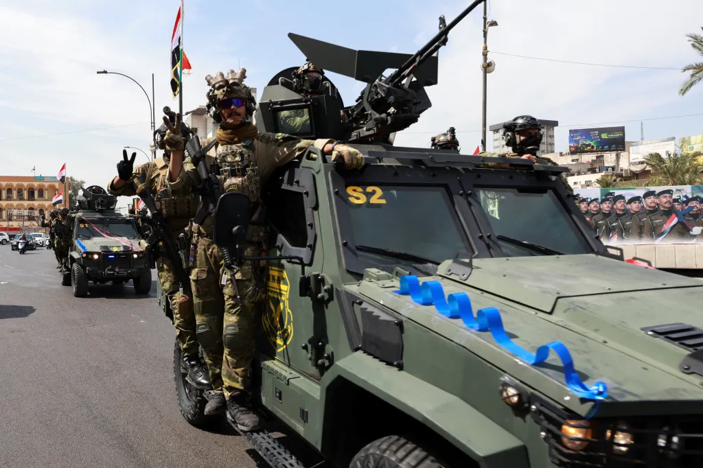 Members of the Iraqi security forces drive in a convoy through Baghdad, Iraq, Sept. 30, 2026.
