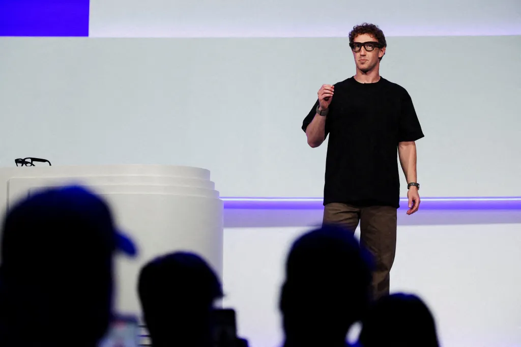 Meta CEO Mark Zuckerberg delivering a speech while wearing Meta Ray-Ban Display glasses.