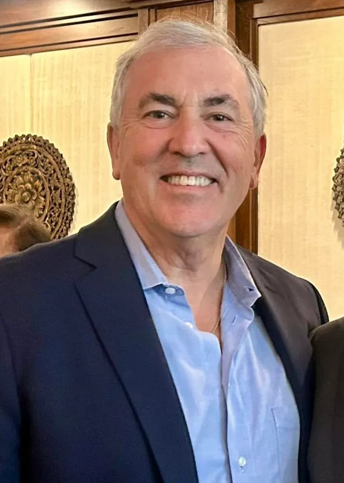 Michael Balboni, President of Adelphi University, smiling.