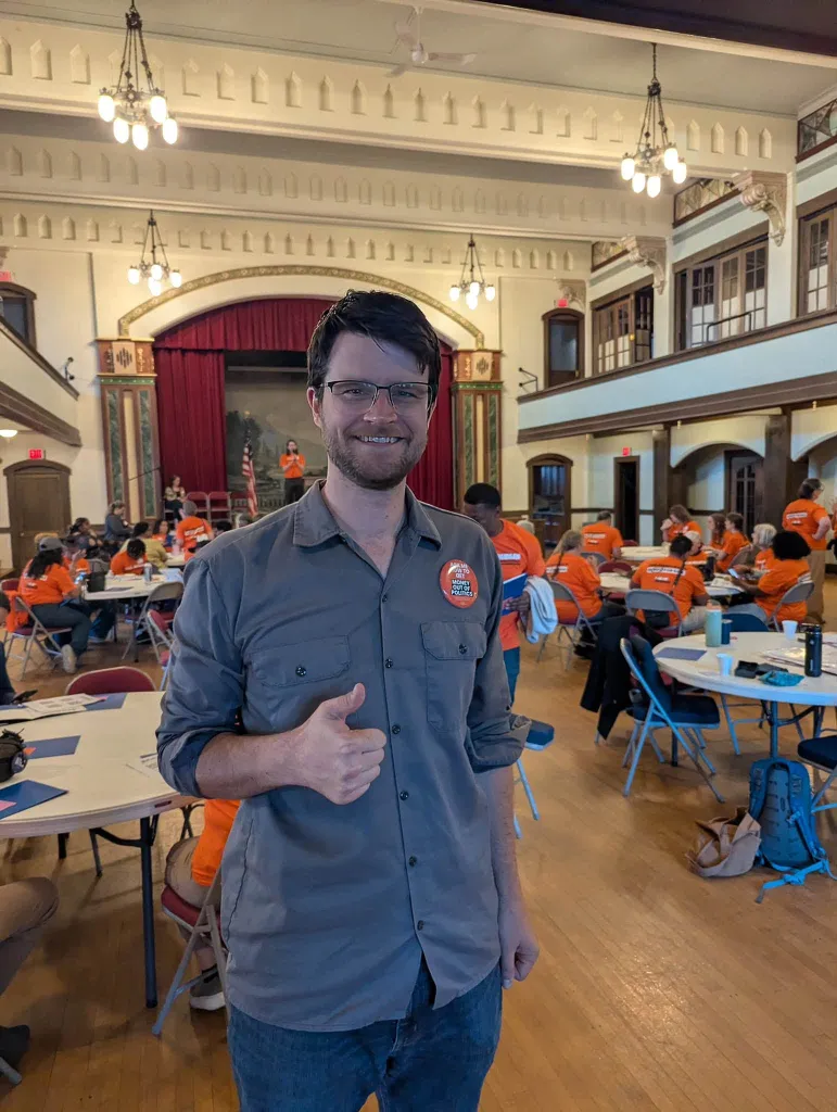 William Lawrence, a Michigan congressional candidate, gives a thumbs-up.
