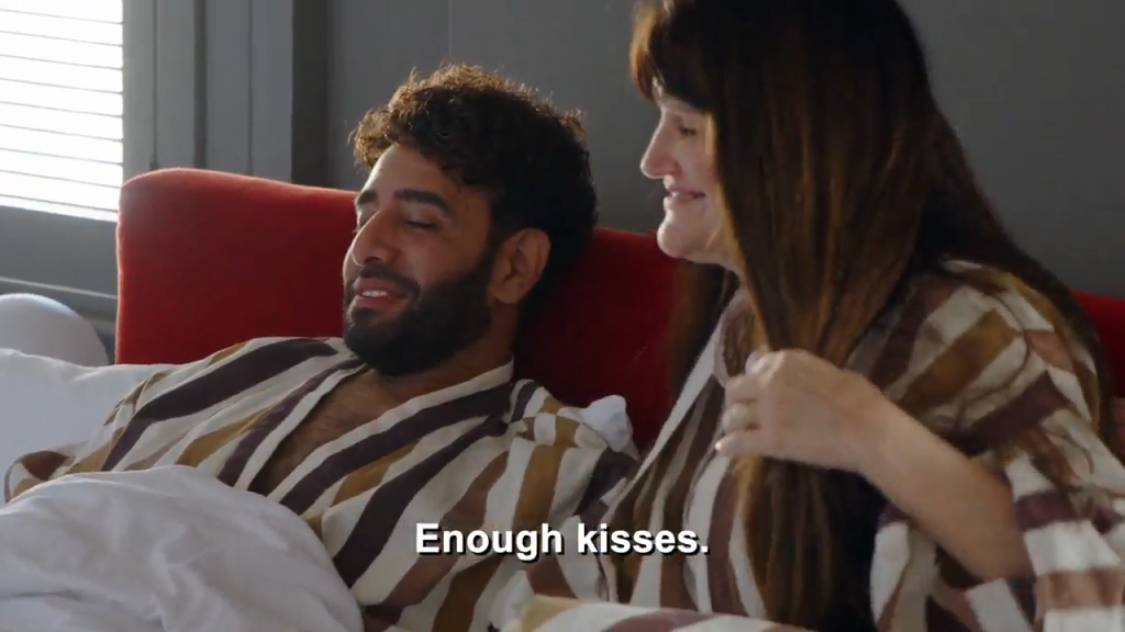 Mido and Debby lying in bed after sex.