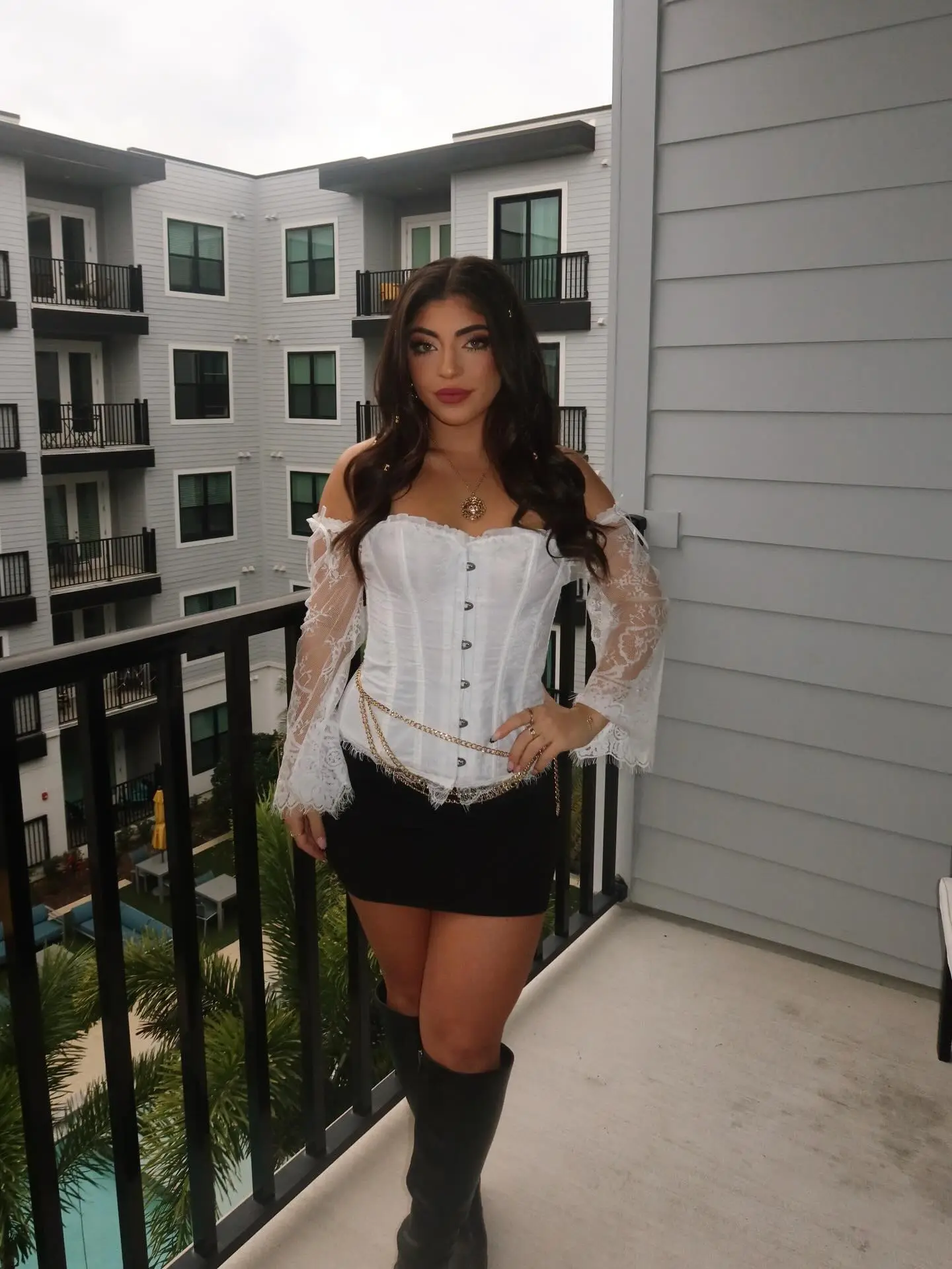Milania Giudice posing on a balcony.