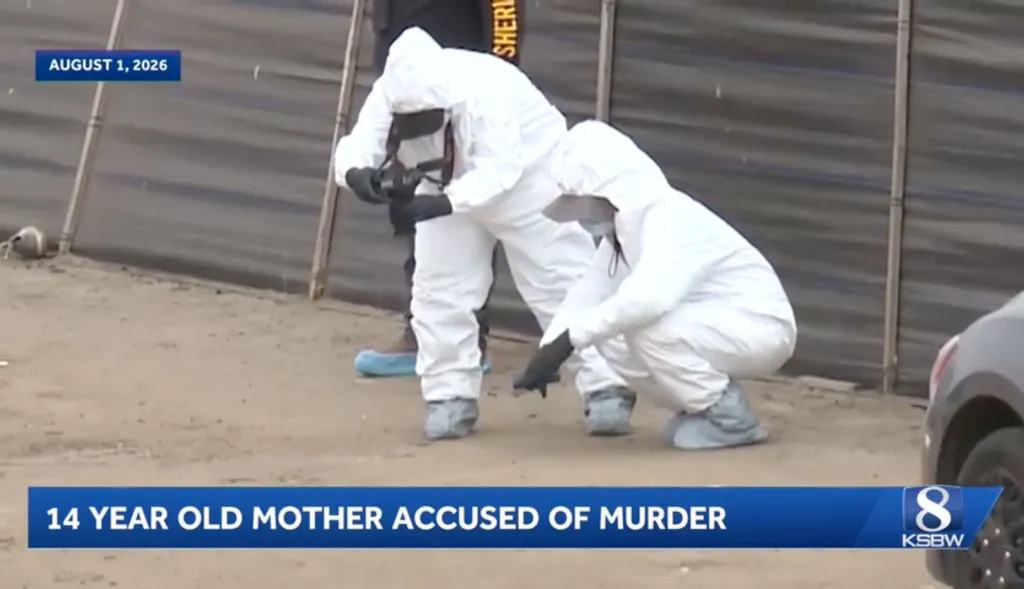 Crime scene investigators in hazmat suits examining the ground.