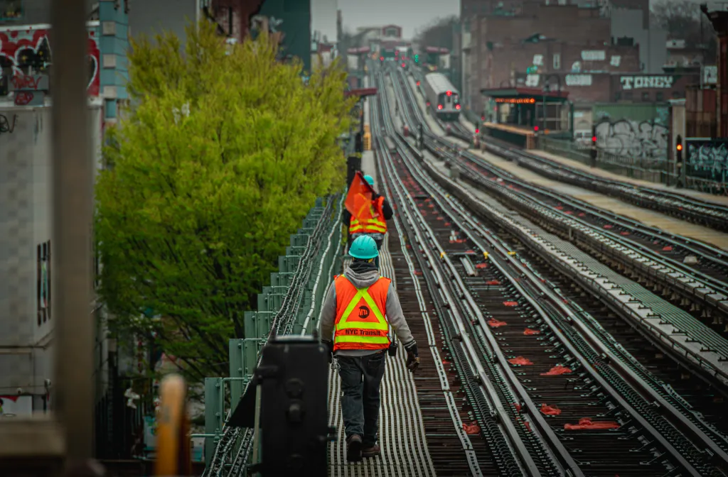 MTA maintenance workers are seen on the subway tracks on Sunday, April 6, 2025, in Manhattan, New York.