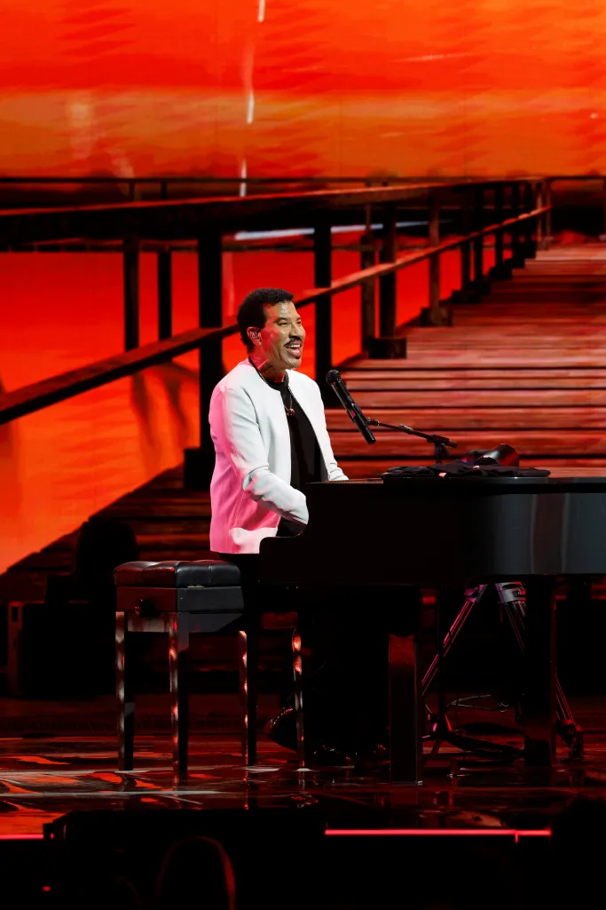 Lionel Richie performing on stage at the Acrisure Amphitheater Opening Concert.