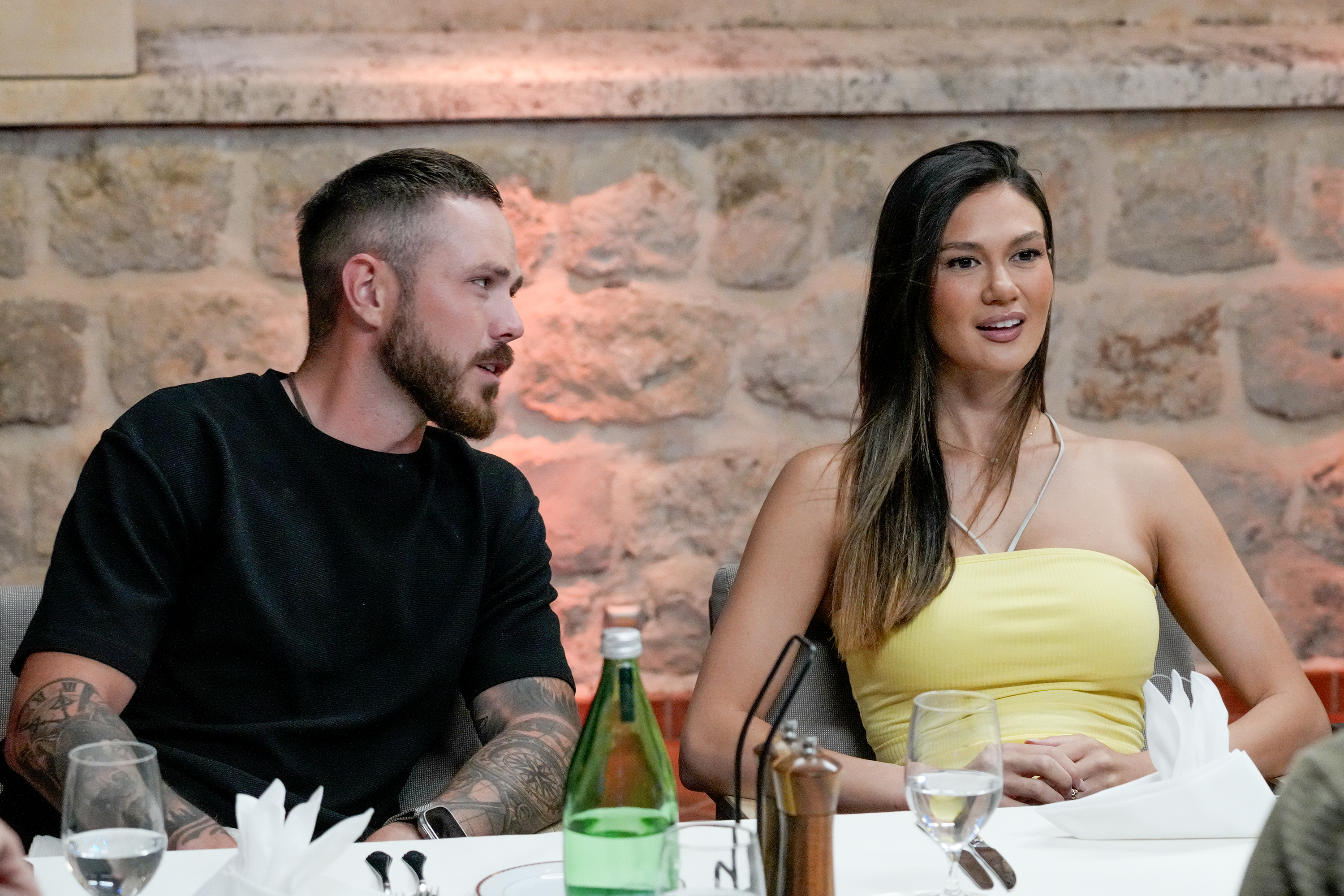 Nathan Gallagher and Gael Cameron sitting at a dining table.