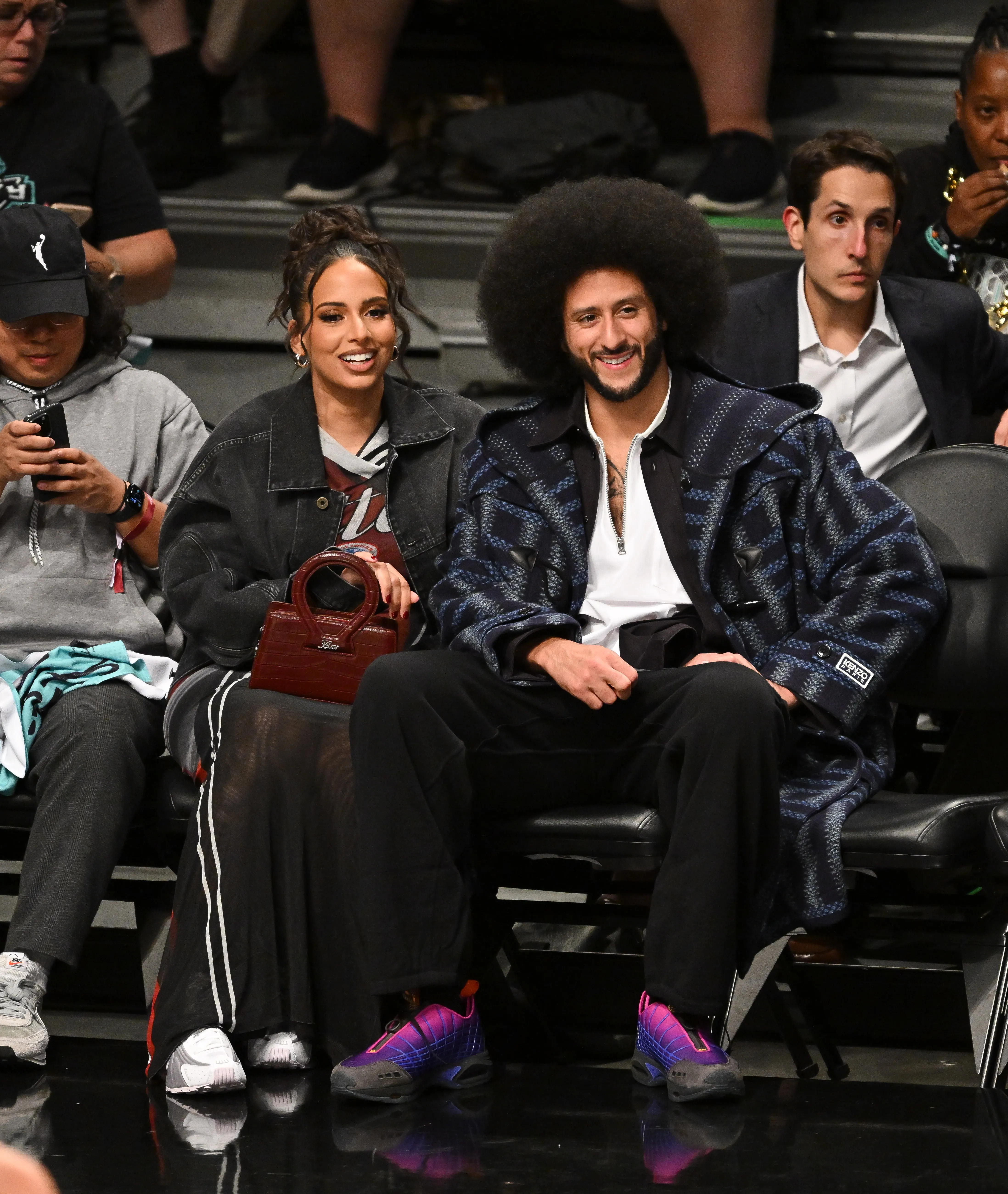 Nessa Diab and Colin Kaepernick attend a basketball game.