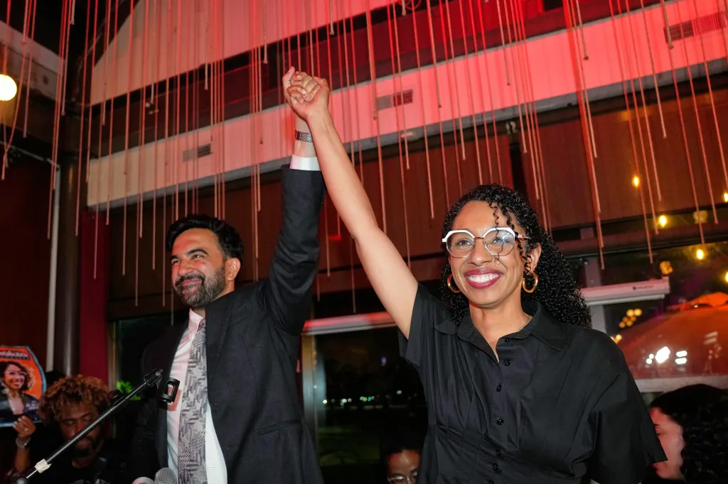 New York City Mayor Zohran Mamdani and Democratic congressional candidate Darializa Avila Chevalier celebrate with raised fists at an election night watch party.