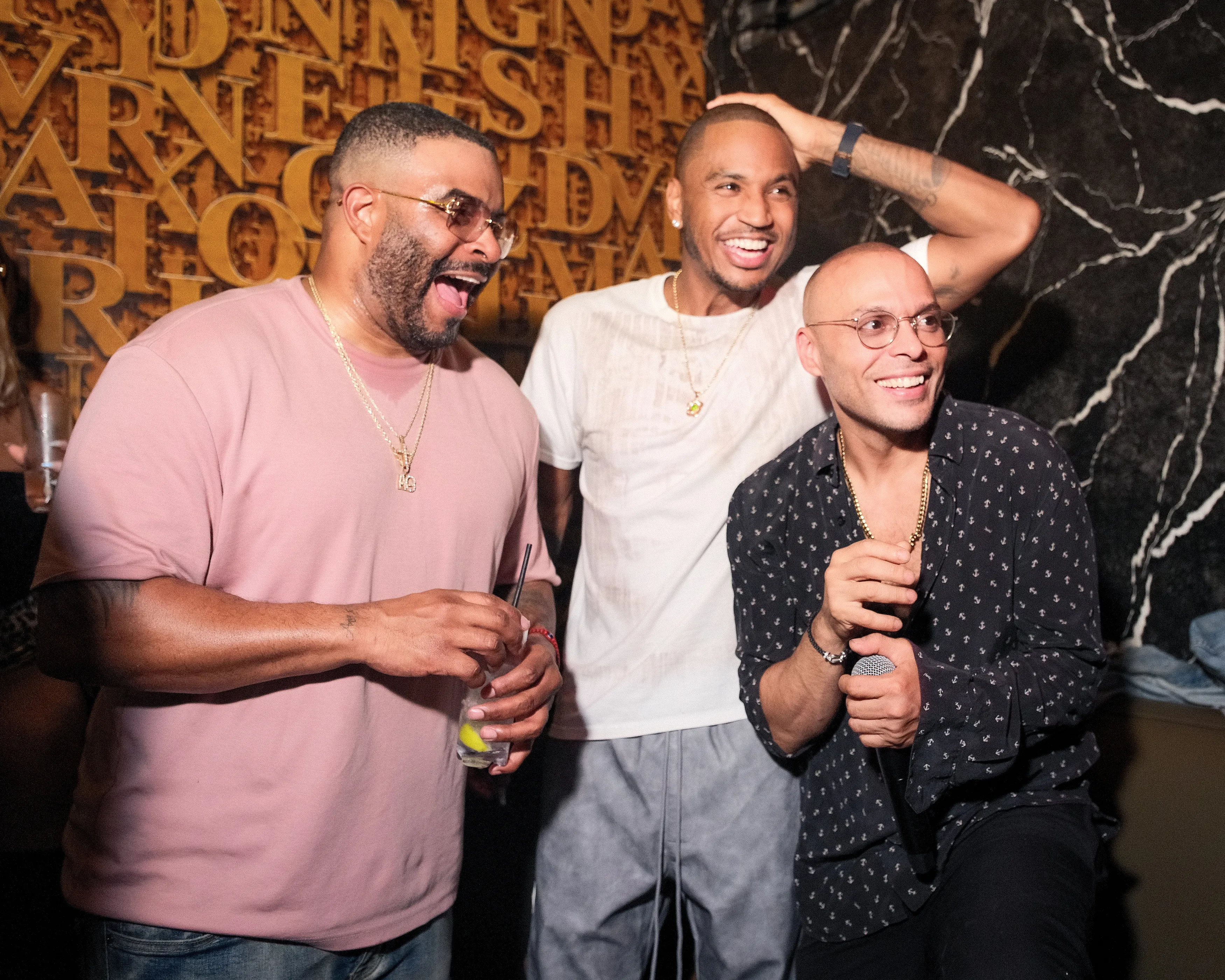 Richie Akiva, Trey Songz, and another guest celebrating Akiva's birthday in NYC.