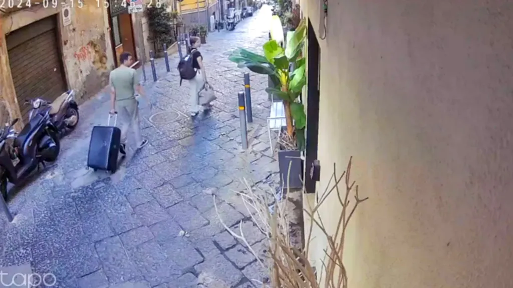 CCTV footage shows Chiara Jaconis hit by a falling object while walking down a street in Naples, Italy.