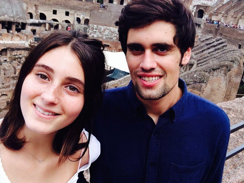 Nick and Romy Reiner smiling in front of the Colosseum.