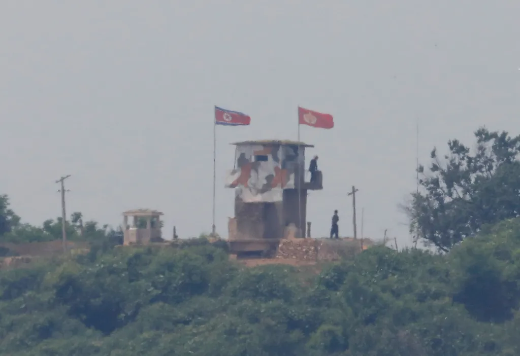 North Korean soldiers are seen at their guard post inside North Korean territory, in a photo taken from Paju, South Korea, near the demilitarized zone (DMZ) separating the two Koreas, on June 17, 2020.