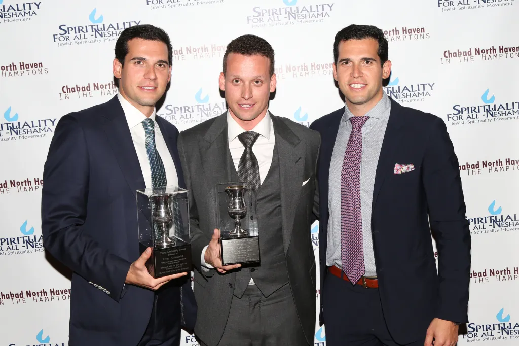 Oren Alexander, Tal Alexander, and Alon Alexander pose with 