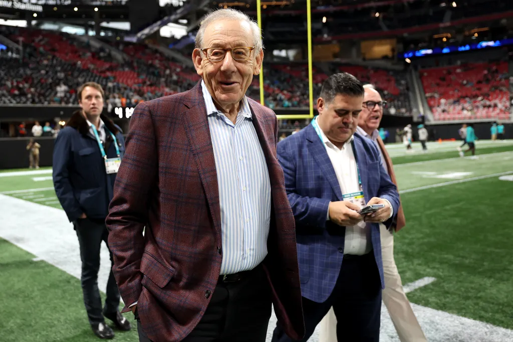 Owner Stephen M. Ross of the Miami Dolphins looking on from the field prior to a game.