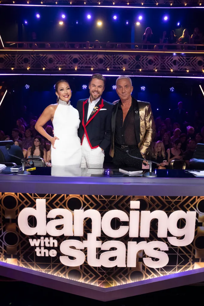 Carrie Ann Inaba, Derek Hough, and Bruno Tonioli posing at the 