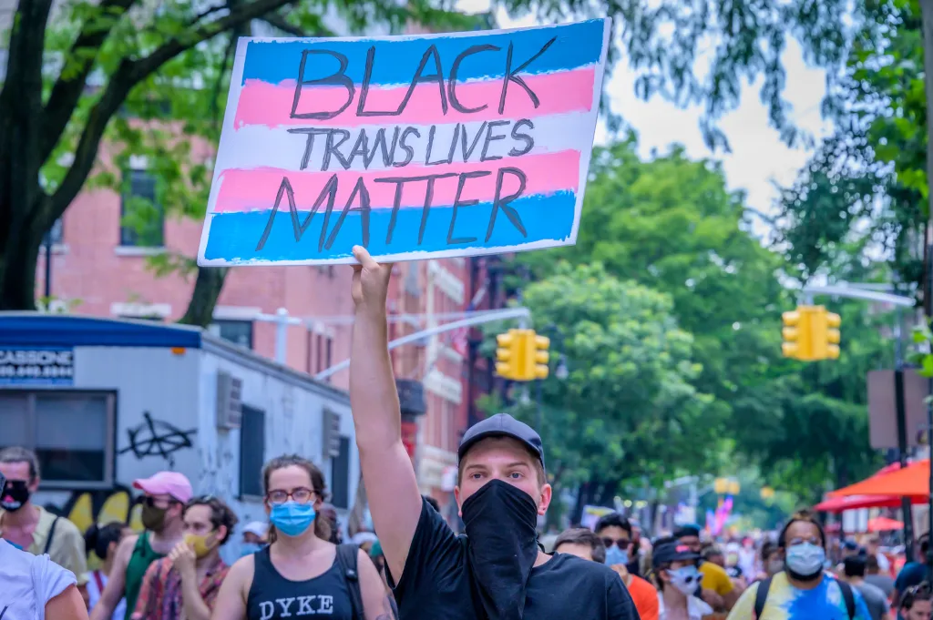 A protester at the Queer Liberation March holds a 