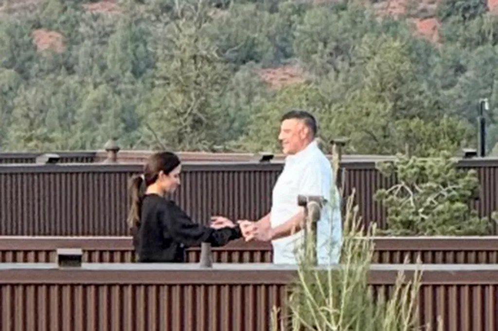 Patriots coach, Mike Vrabel, and reporter Dianna Russini holding hands at Ambiente Sedona hotel.