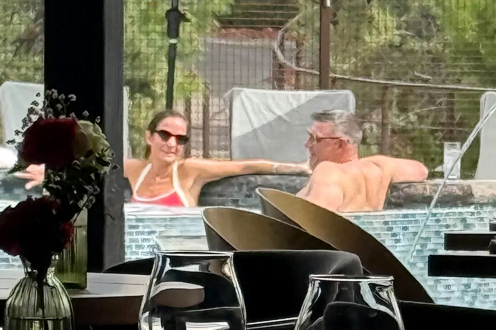Patriots coach, Mike Vrabel, and reporter Dianna Russini in a hot tub.