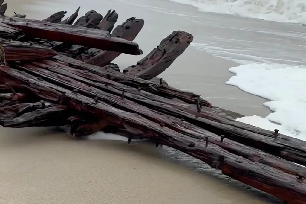 The remains of a 19th-century shipwreck were uncovered by the waves on a Nantucket beach during the intense nor'easter striking the region on Sept. 26, 2026.